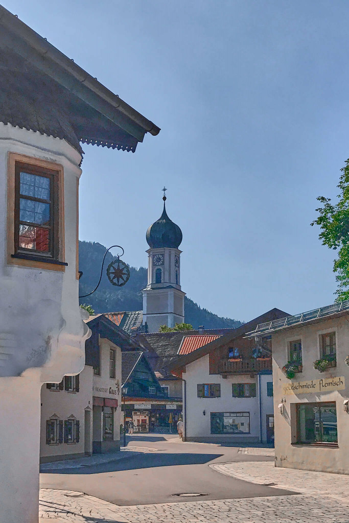 View of Parish Church St. Peter and Paul from the centre of the small town Oberammergau, southern Germany